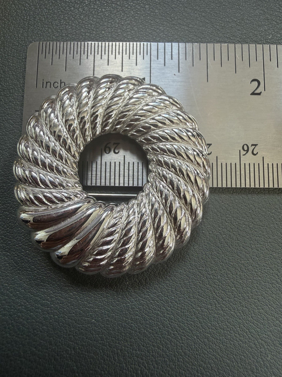 Vintage MONET Silver-Tone Circle Brooch – 1.5" Wreath Design w/ Spinning Texture
