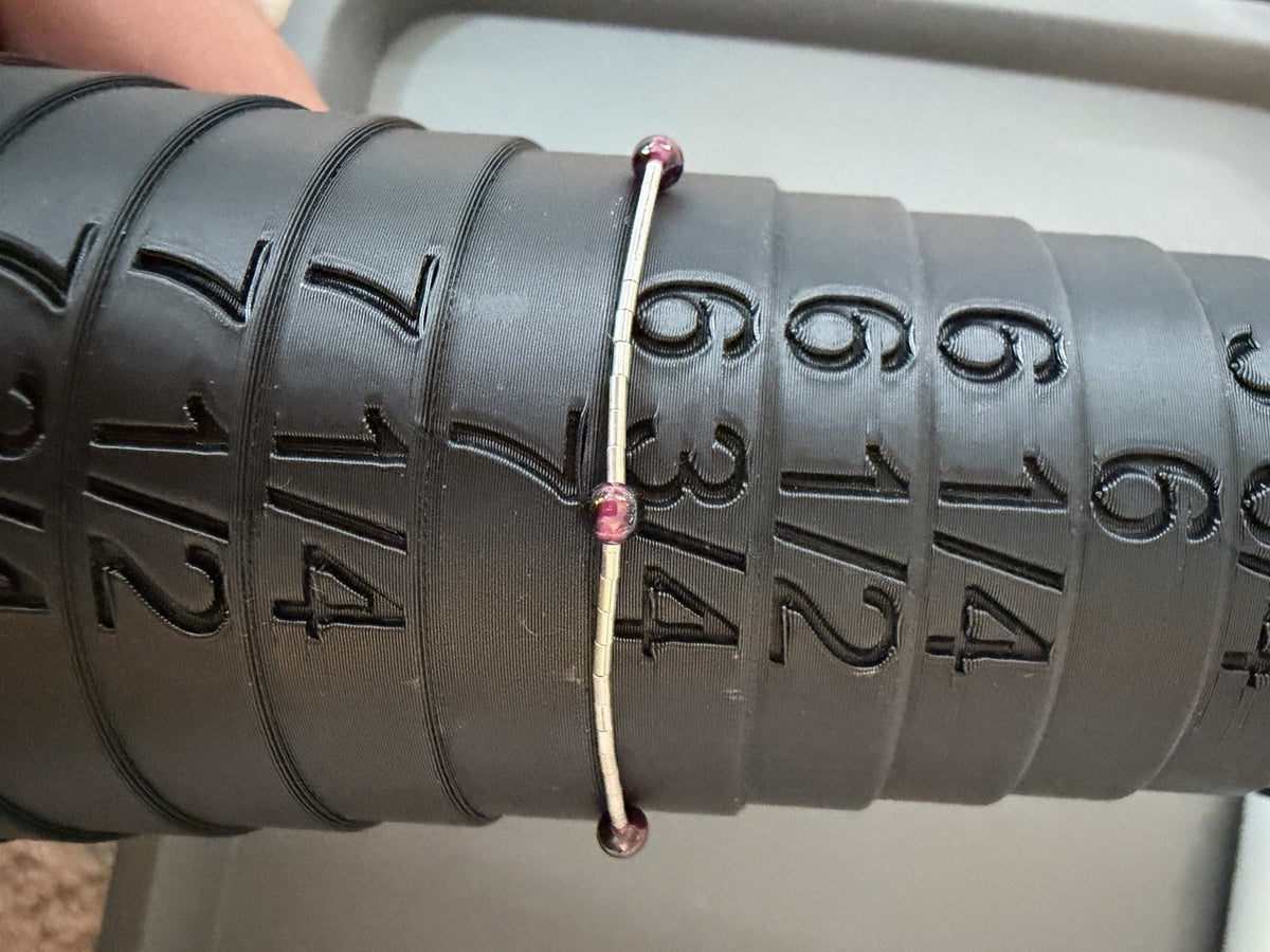 Sterling Silver  Lobster Clasp Bracelet Adorned with Station Garnet (?) Beads.