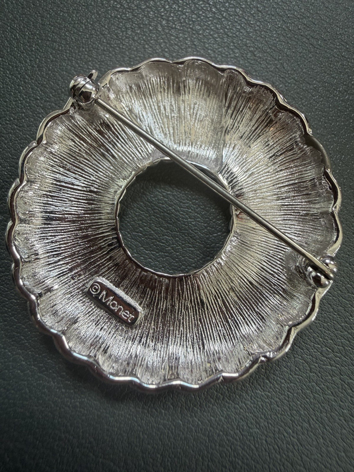 Vintage MONET Silver-Tone Circle Brooch – 1.5" Wreath Design w/ Spinning Texture