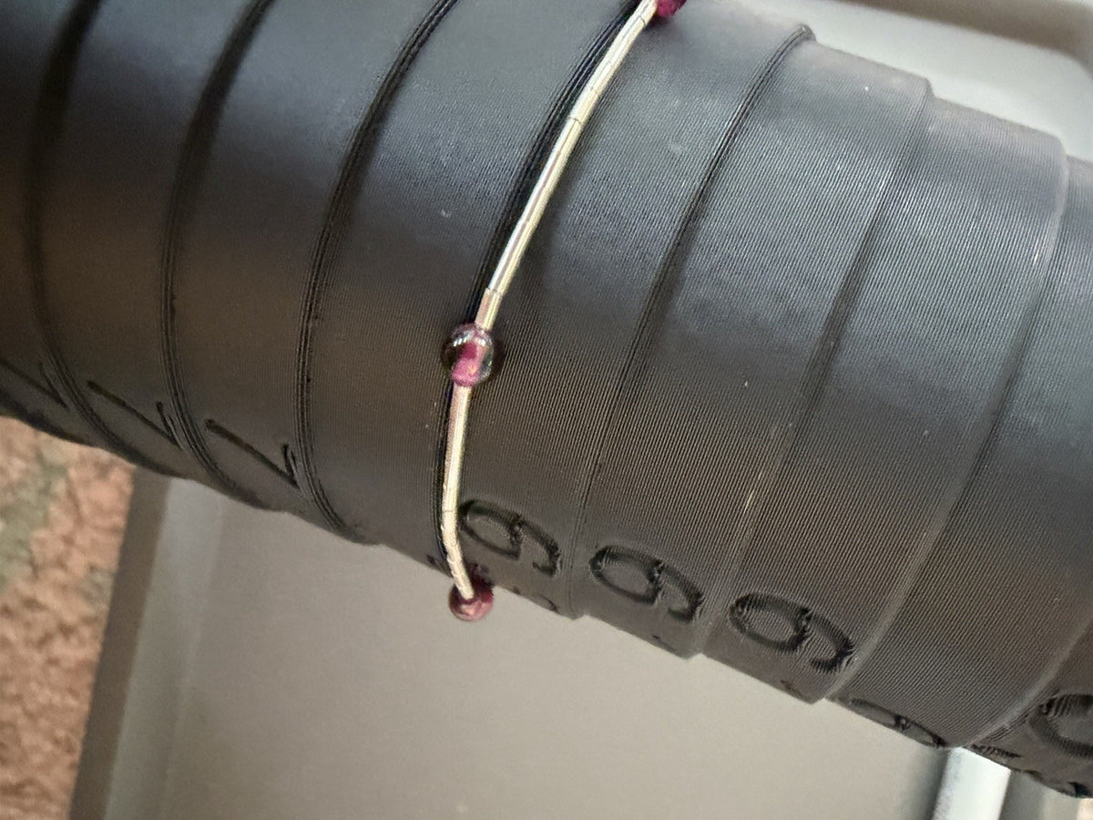 Sterling Silver  Lobster Clasp Bracelet Adorned with Station Garnet (?) Beads.