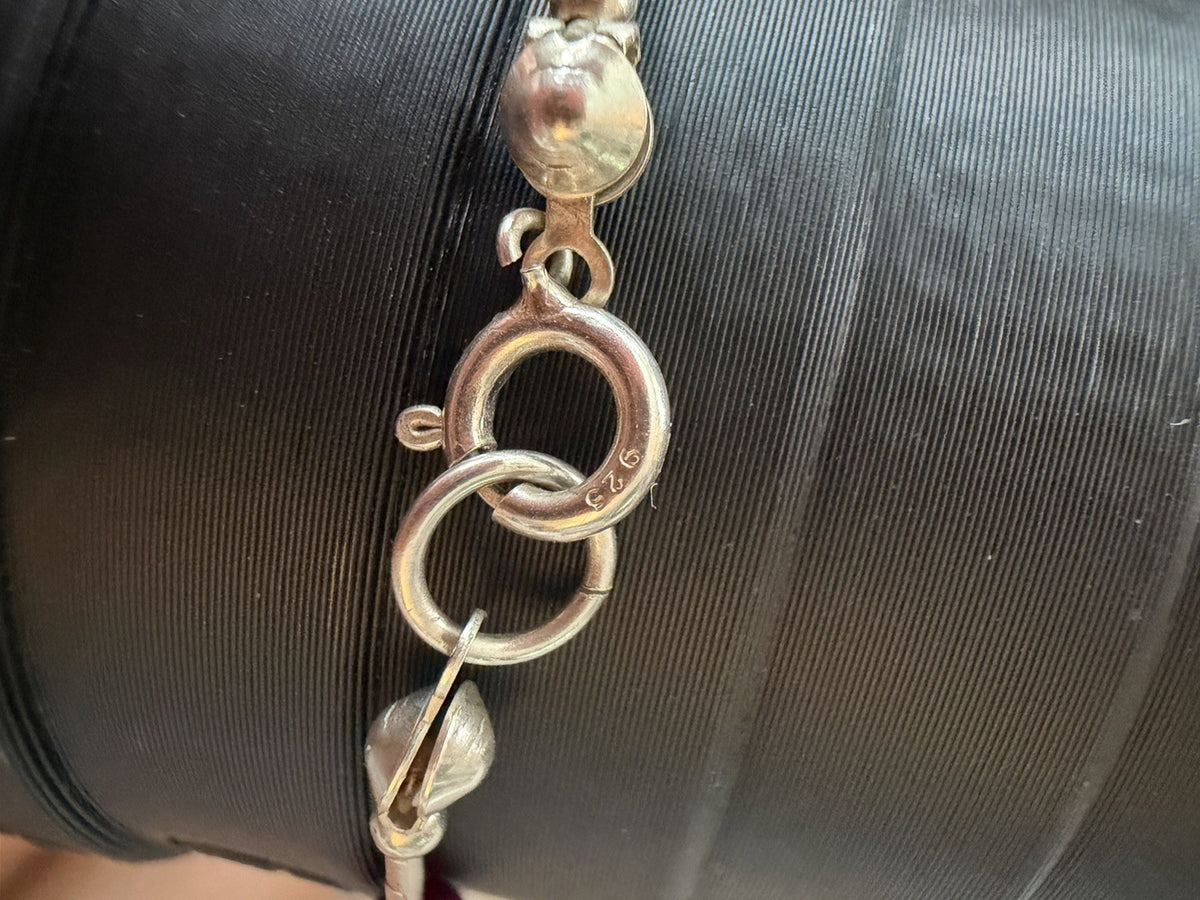 Sterling Silver  Lobster Clasp Bracelet Adorned with Station Garnet (?) Beads.